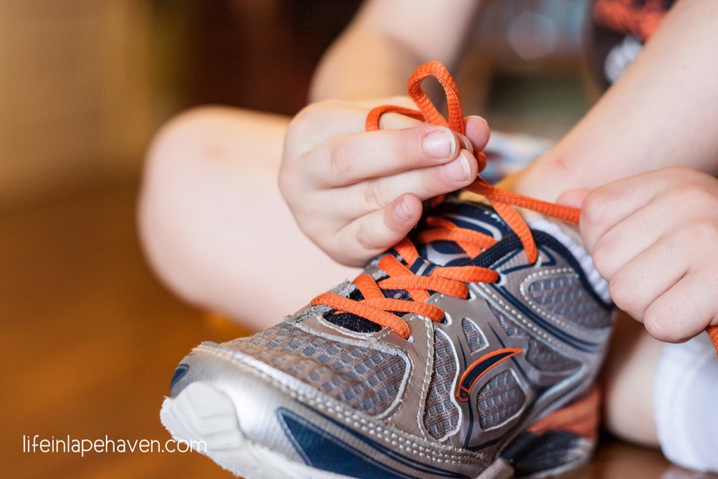 Life in Lape Haven: Trying & Tying - Elijah tying his shoelaces