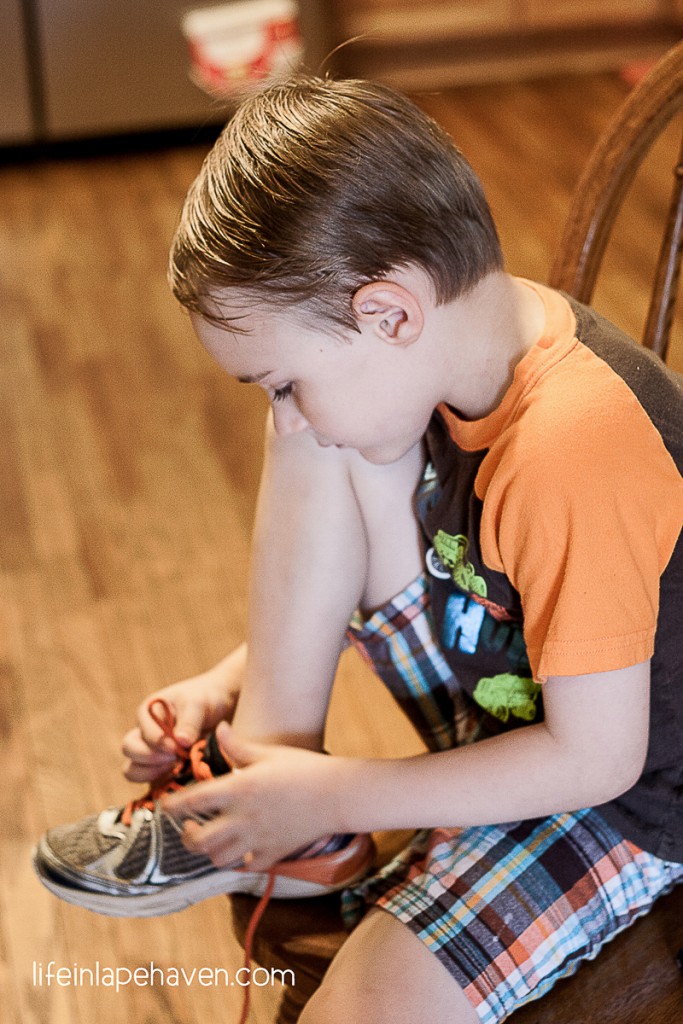 Life in Lape Haven: Trying & Tying - Elijah working to tie his shoelaces